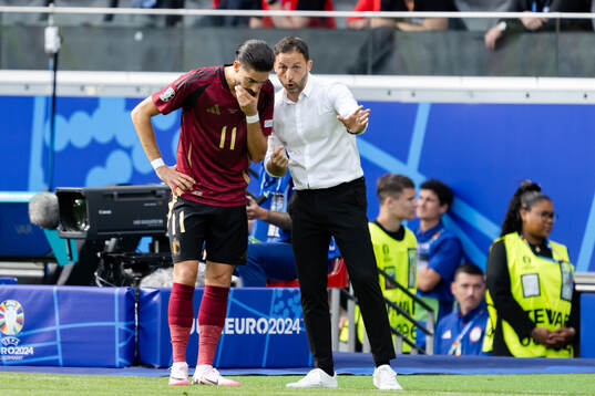 Yannick Carrasco and Head coach Domenico Tedesco of Belgium