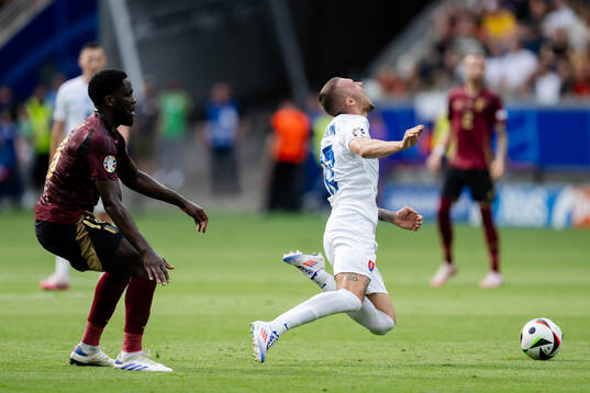 Orel Mangala of Belgium and Lukas Haraslin of Slovakia