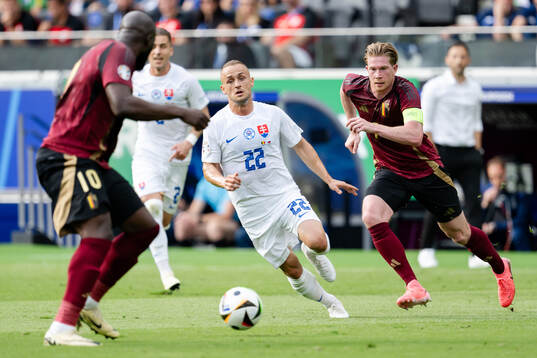 Stanislav Lobotka of Slovakia and Kevin De Bruyne of Belgium