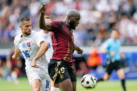 David Hancko of Slovakia and Romelu Lukaku of Belgium