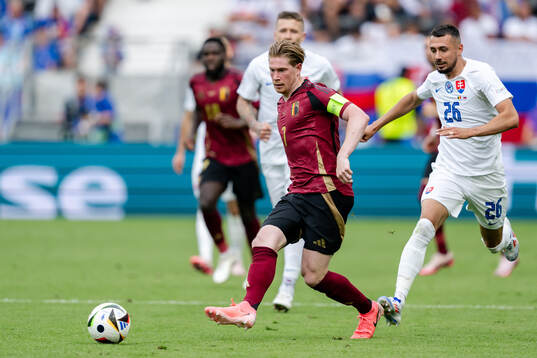 Kevin De Bruyne of Belgium and Ivan Schranz of Slovakia