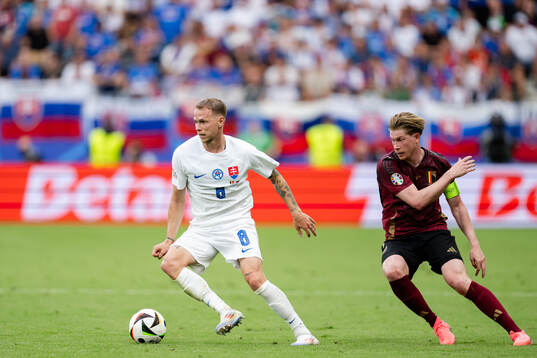 Ondrej Duda of Slovakia and Kevin De Bruyne of Belgium