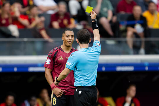 Youri Tielemans of Belgium receives a yellow card