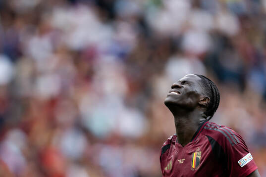 Amadou Onana of Belgium in pain