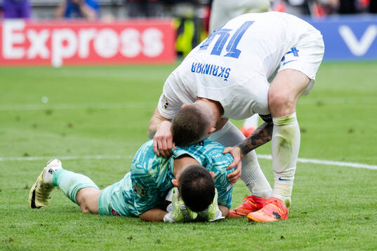 Milan Skriniar and goalkeeper Martin Dubravka of Slovakia