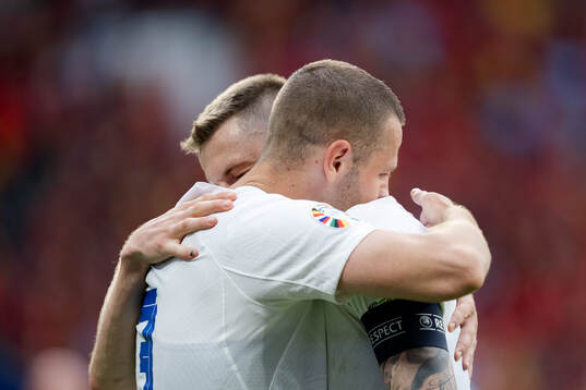 Denis Vavro and Milan Skriniar of Slovakia celebrate