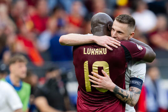 Romelu Lukaku of Belgium and Milan Skriniar of Slovakia