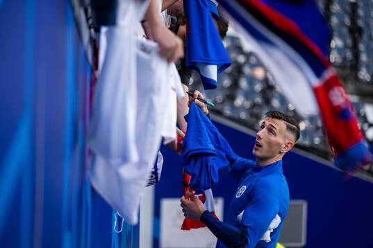 Robert Bozenik of Slovakia signs autographs
