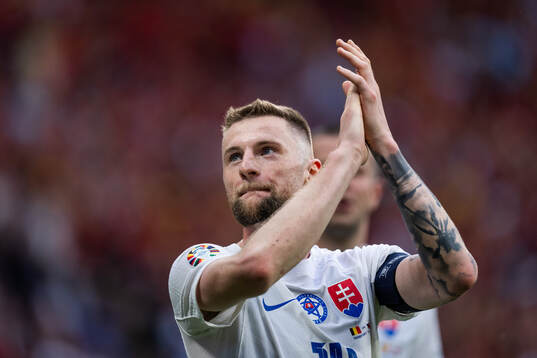 Milan Skriniar of Slovakia celebrates