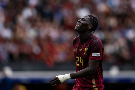 Amadou Onana of Belgium looks dejected