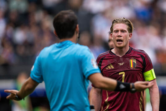 Kevin De Bruyne of Belgium reacts towards referee Umut Meler