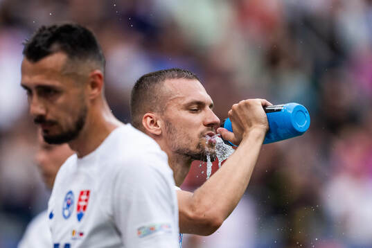 Lukas Haraslin of Slovakia drinks water