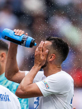 Ivan Schranz of Slovakia sprays water in his face