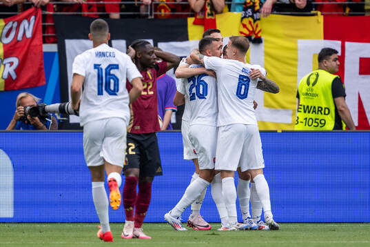 Ivan Schranz of Slovakia celebrates with Ondrej Duda