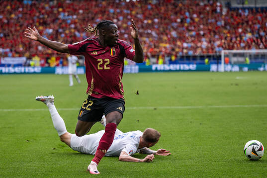 Jeremy Doku of Belgium reacts