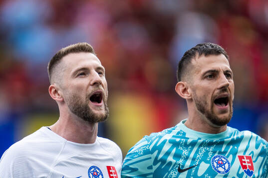 Milan Skriniar and goalkeeper Martin Dubravka of Slovakia