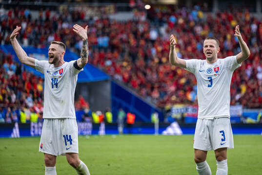 Milan Skriniar and Denis Vavro of Slovakia celebrate