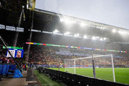 General view as rain falls inside the stadium
