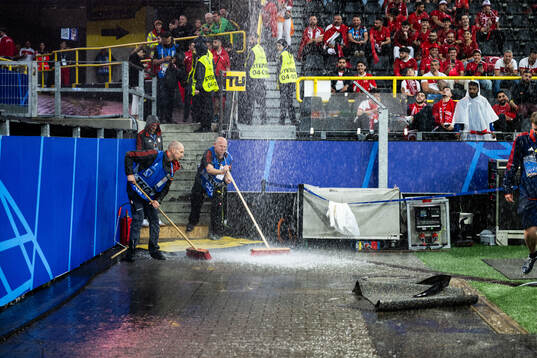 General view as rain falls inside the stadium