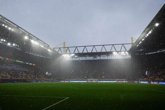 General view as rain falls inside the stadium