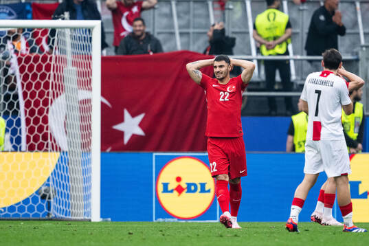 Kaan Ayhan of Türkiye looks dejected