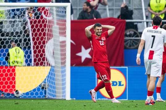 Kaan Ayhan of Türkiye looks dejected