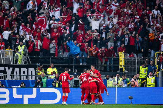 Mert Muldur of Türkiye celebrates with team mates