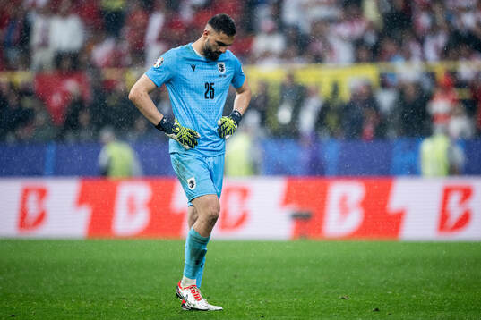 Giorgi Mamardashvili of Georgia looks dejected