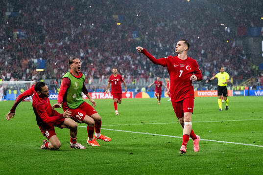 Kerem Akturkoglu of Türkiye celebrates with Hakan