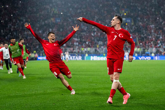 Kerem Akturkoglu of Türkiye celebrates with Arda Guler
