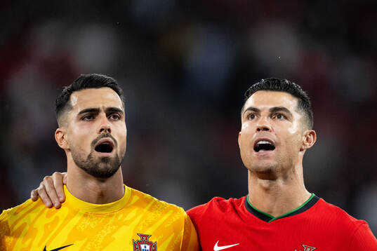 Diogo Costa and Cristiano Ronaldo of Portugal