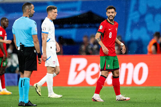 Bruno Fernandes of Portugal reacts towards referee Marco