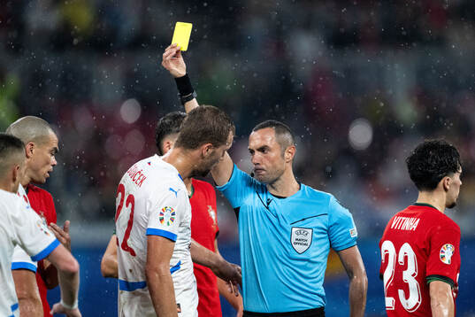 Tomas Soucek of Czech Republic receives a yellow card from