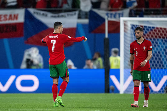 Cristiano Ronaldo of Portugal reacts and Bruno Fernandes