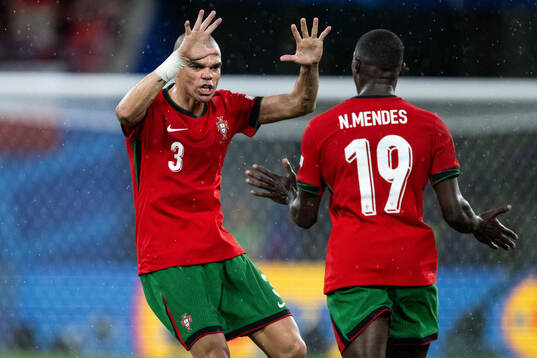 Pepe and Nuno Mendes of Portugal celebrates