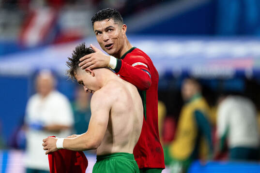Francisco Conceicao of Portugal celebrates with Cristiano
