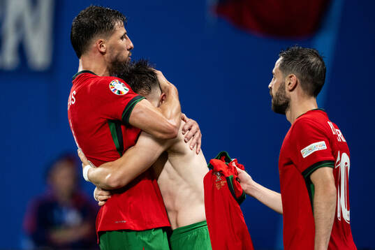 Francisco Conceicao of Portugal celebrates with Ruben Dias