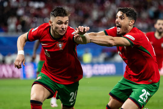 Francisco Conceicao and Pedro Neto of Portugal celebrate