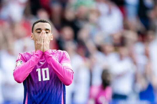 Jamal Musiala of Germany looks dejected