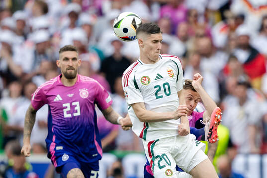 Roland Sallai of Hungary and Joshua Kimmich of Germany