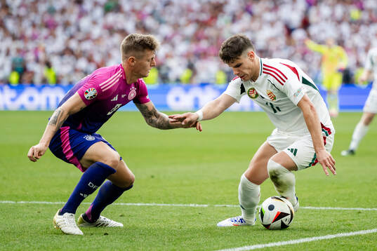 Toni Kroos of Germany and Milos Kerkez of Hungary
