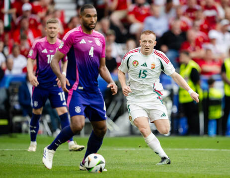 Jonathan Tah of Germany and Laszlo Kleinheisler of Hungary
