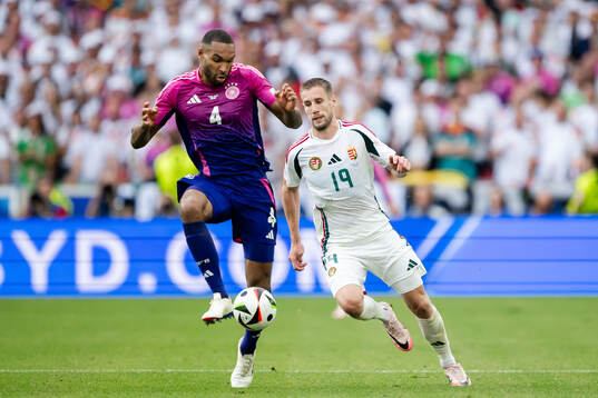 Jonathan Tah of Germany and Barnabas Varga of Hungary