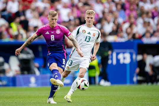 Toni Kroos of Germany and Andras Schäfer of Hungary