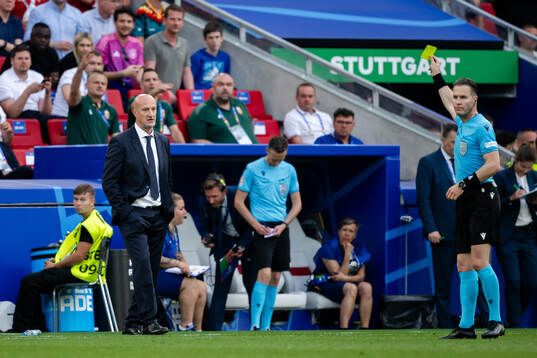 Head coach Marco Rossi of Hungary receives a yellow card