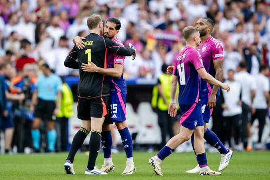 Goalkeeper Manuel Neuer and Emre Can of Germany