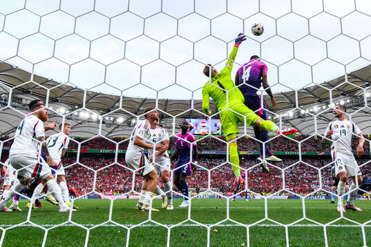 goalkeeper Peter Gulacsi of Hungary and Jonathan Tah of