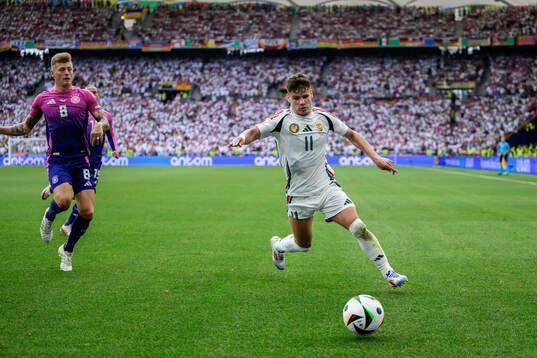 Toni Kroos of Germany and Milos Kerkez of Hungary