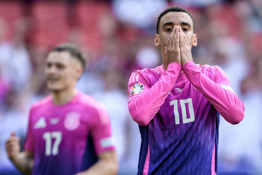 Jamal Musiala of Germany looks dejected