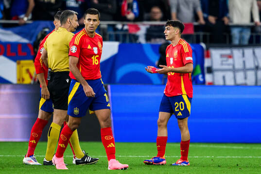 Pedri of Spain in discussion with Referee Slavko Vincic